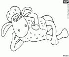 Shaun owce odpoczynku spokojnie. Baranek polega na ziemi
